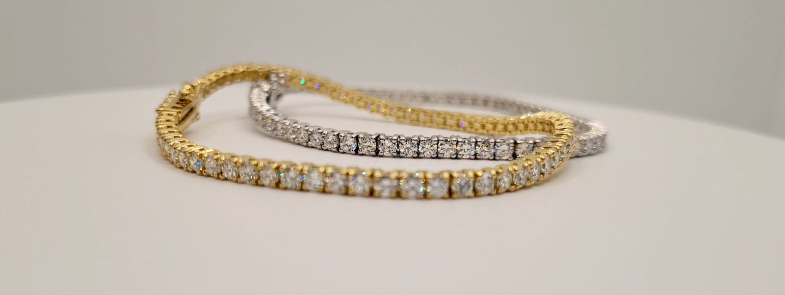 4 carat round brilliant lab grown diamond tennis bracelet shown in both 14K yellow gold and 14K white gold