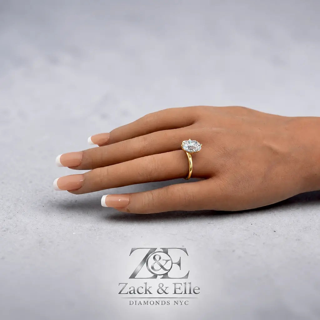 4.00 Ct F VS1 Old Mine Cushion Lab-Grown Diamond Solitaire Ring, in yellow gold, on hand