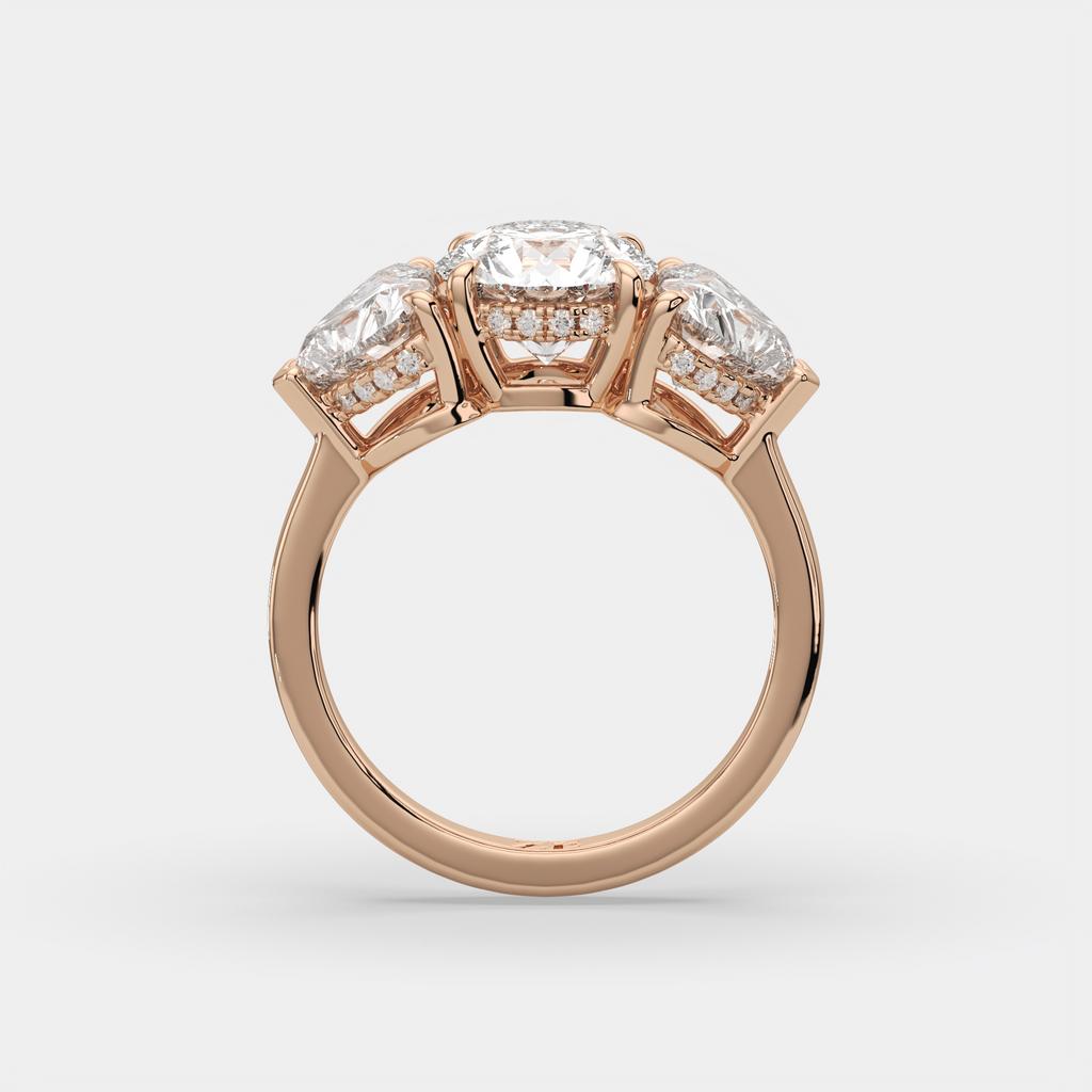 4.15 Ct D VS1 Round 3 Stone Ring With Heart Shape Accents and Halo, in rose gold, side profile