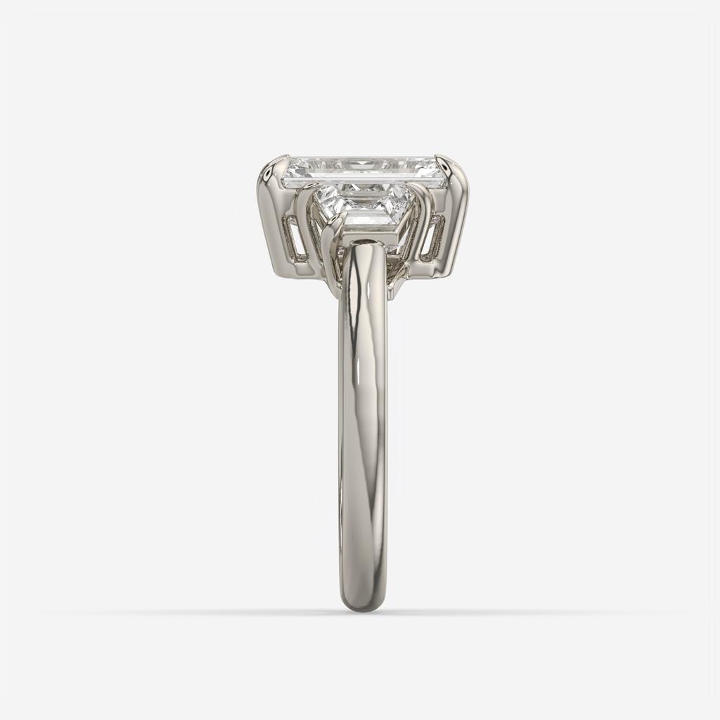 4.60 Ct E VS1 Emerald Cut Diamond Three Stone Ring with Step Cut Trapezoid Accents, in white gold, front view