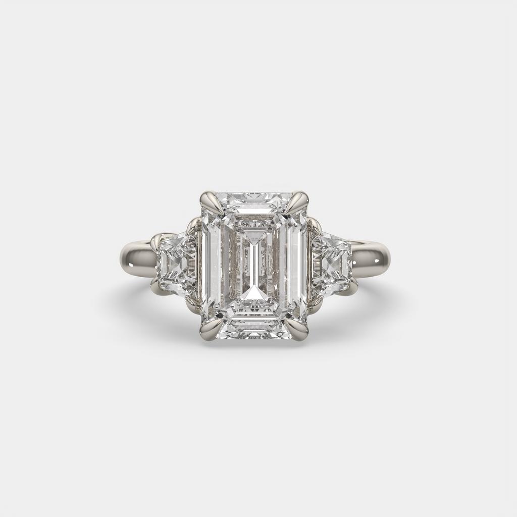 4.60 Ct E VS1 Emerald Cut Diamond Three Stone Ring with Step Cut Trapezoid Accents, in white gold, front view