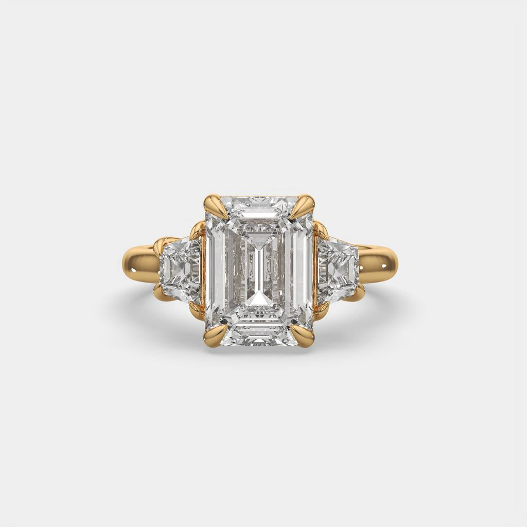 4.60 Ct E VS1 Emerald Cut Diamond Three Stone Ring with Step Cut Trapezoid Accents, in yellow gold, front view