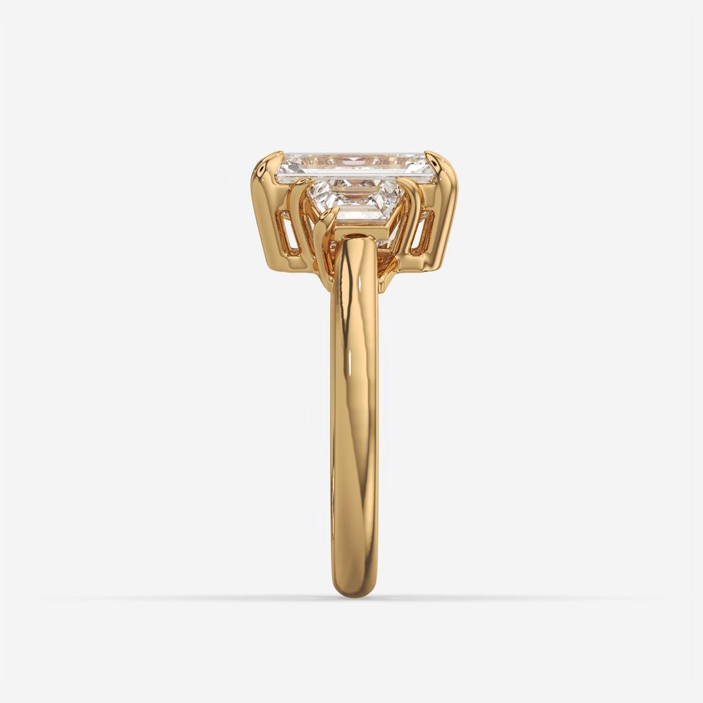 4.60 Ct E VS1 Emerald Cut Diamond Three Stone Ring with Step Cut Trapezoid Accents, in yellow gold, side profile