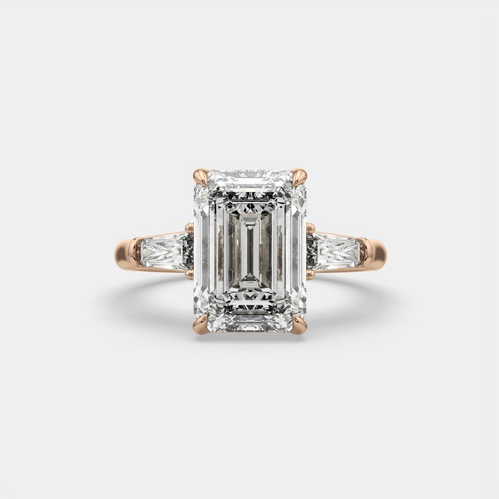 5.60 Ct E VS1 Emerald Cut Lab-Grown Diamond Three Stone Ring with Tapered Baguettes, in rose gold, front view