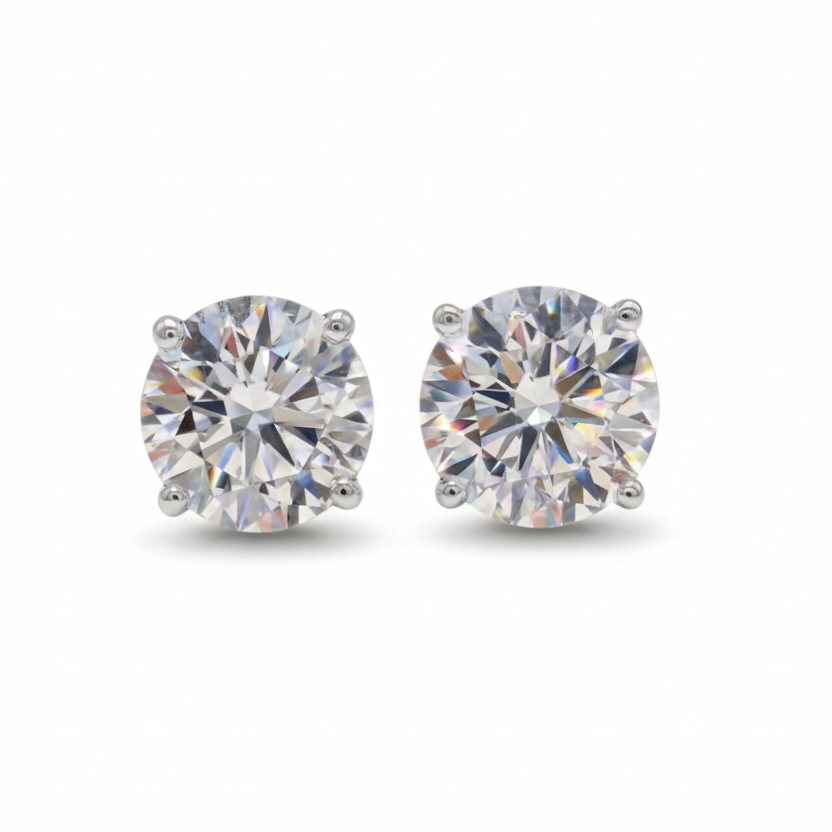 Round brilliant lab-grown diamond studs showing actual size