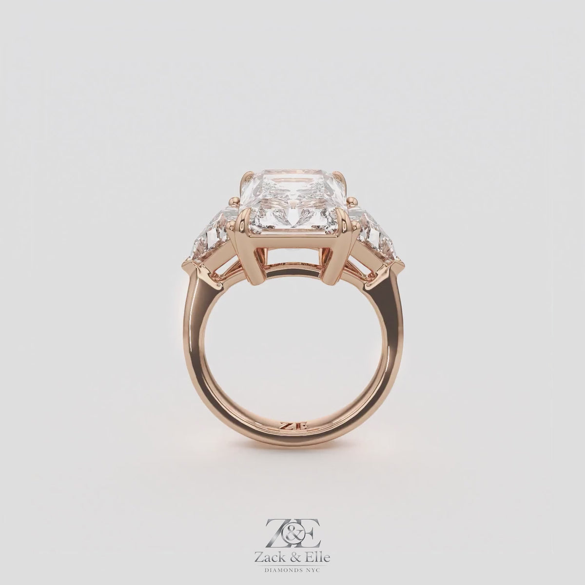 7.20 Ct E VS1 Radiant Cut Lab-Grown Diamond Three Stone Ring with Trapezoid Side Diamonds, in rose gold, 360 spin