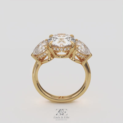 5.20 Ct D VS1 Round Three Stone Ring With Heart Shape Accents and Halo, in white gold, 360 spin