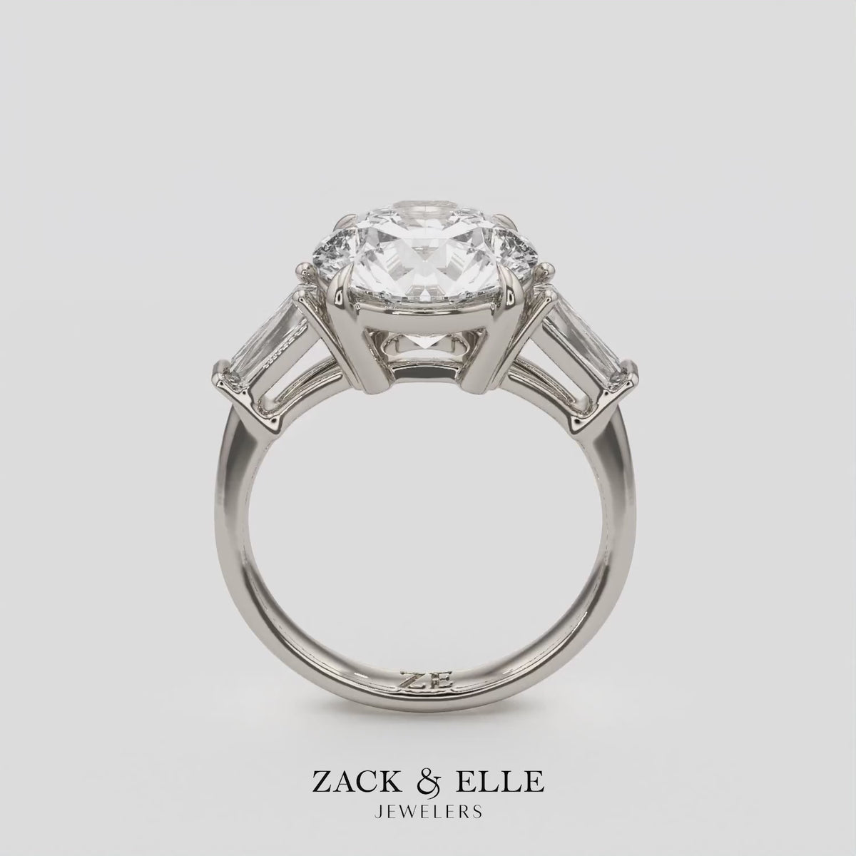 2.40 Ct D Color VS1 Round Diamond Three Stone Ring With Tapered Baguettes, in white gold, 360 spin