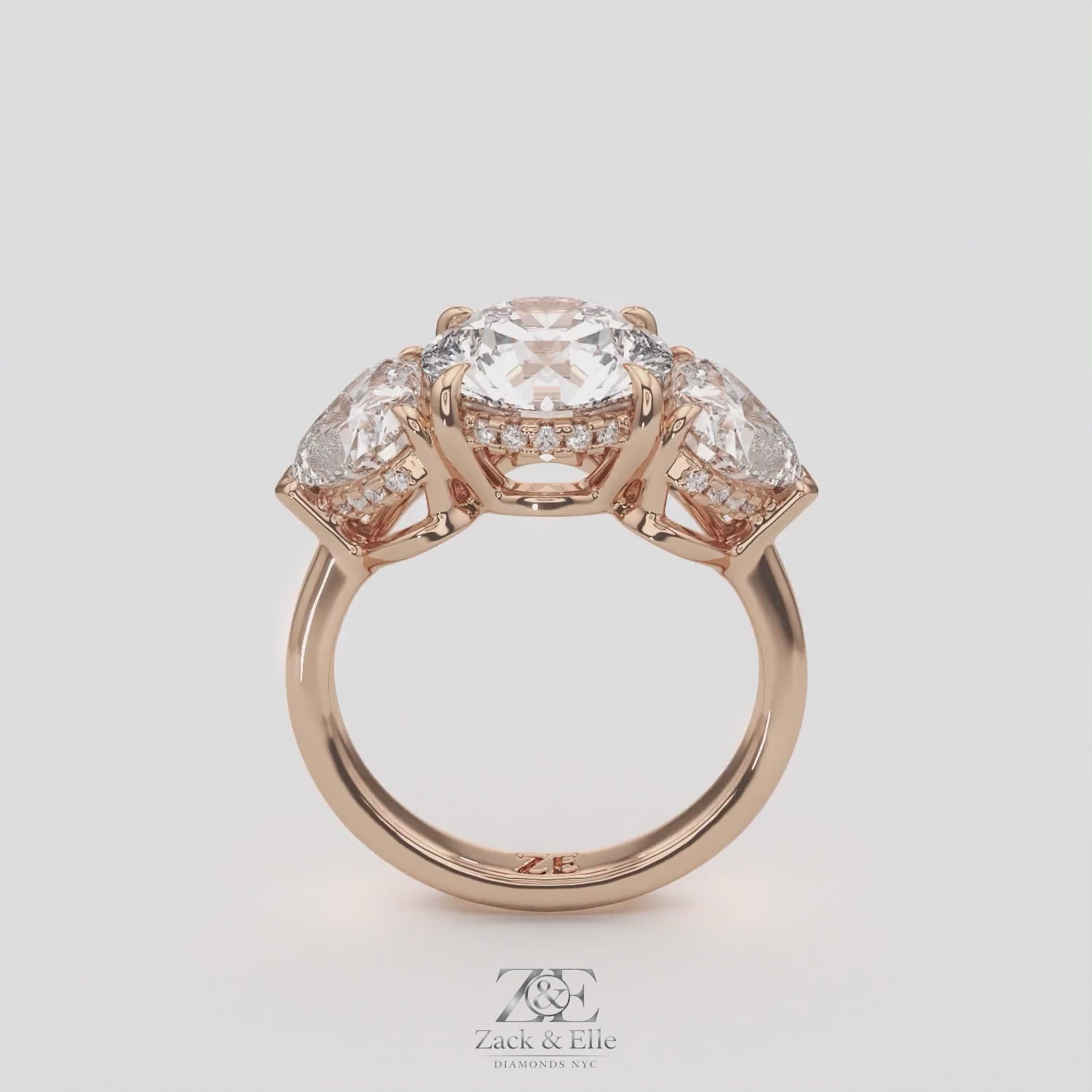 5.20 Ct D VS1 Round Three Stone Ring With Heart Shape Accents and Halo, in white gold, 360 spin