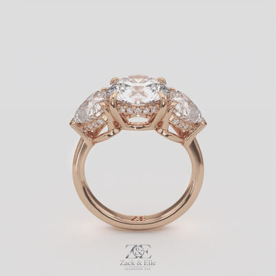 5.20 Ct D VS1 Round Three Stone Ring With Heart Shape Accents and Halo, in white gold, 360 spin