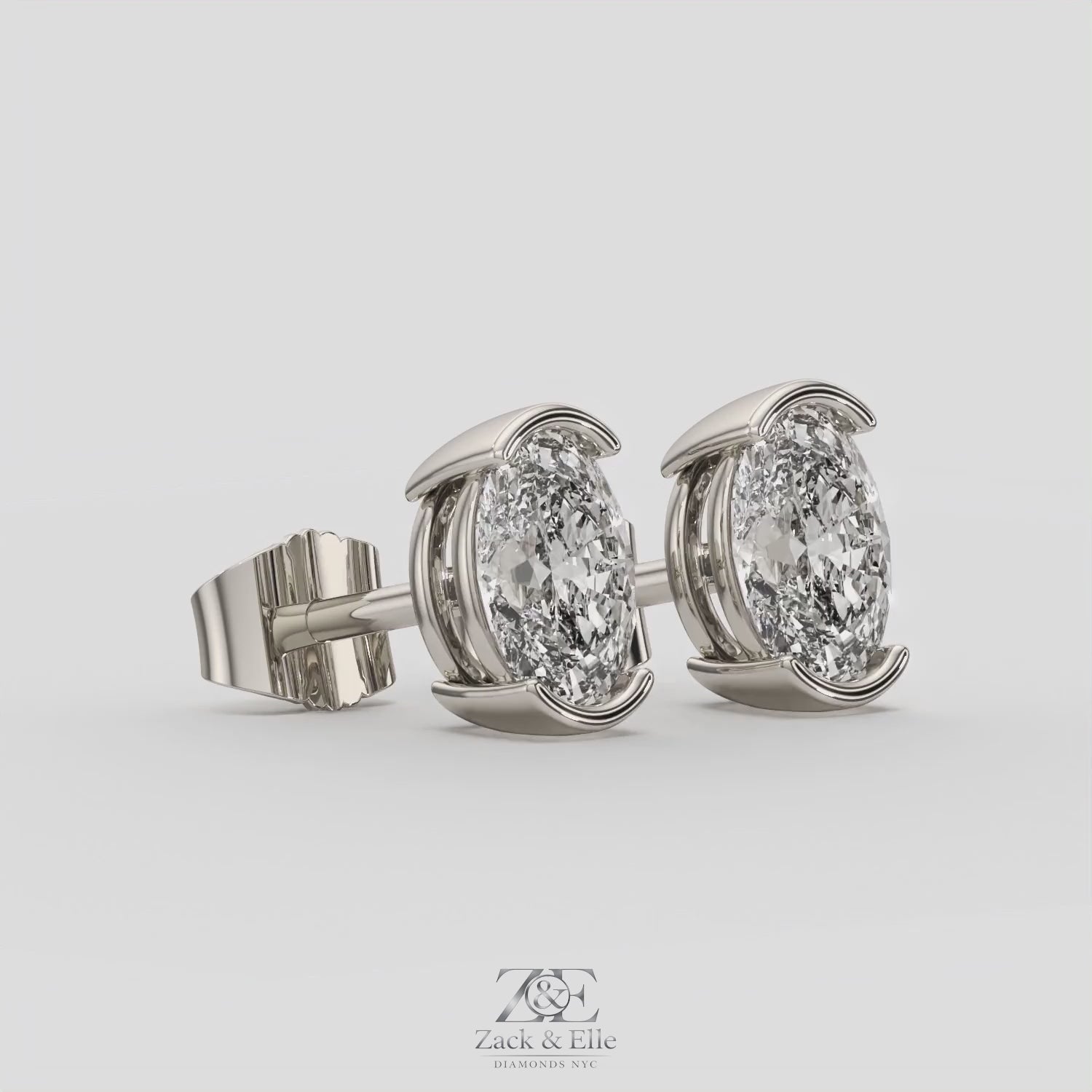 2.00 Ct D VS1 Oval Semi Bezel Diamond Studs, in white gold, 360 spin