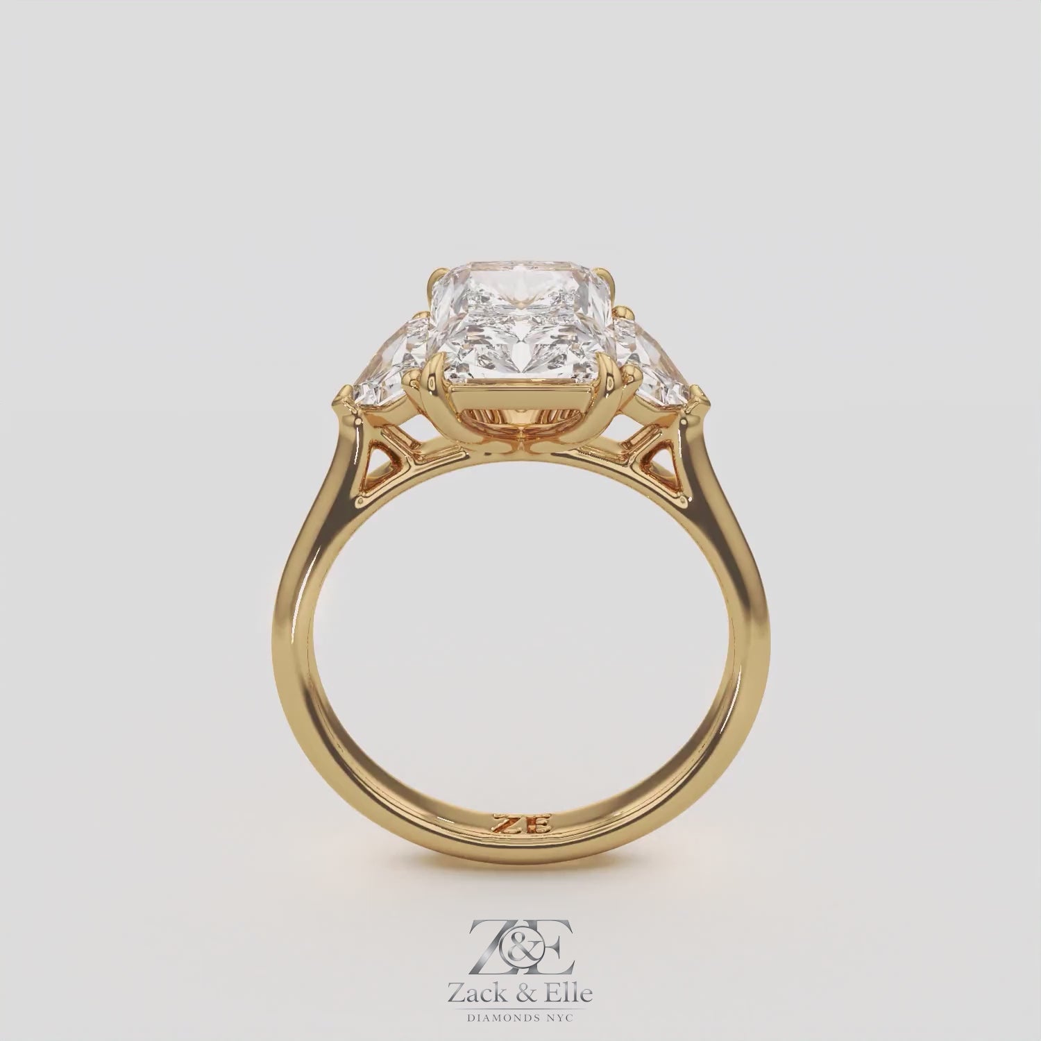 3.50 Ct E VS1 Radiant Three Stone Ring With Trapezoid Accents, in white gold, 360 spin
