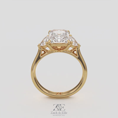 3.50 Ct E VS1 Radiant Three Stone Ring With Trapezoid Accents, in white gold, 360 spin