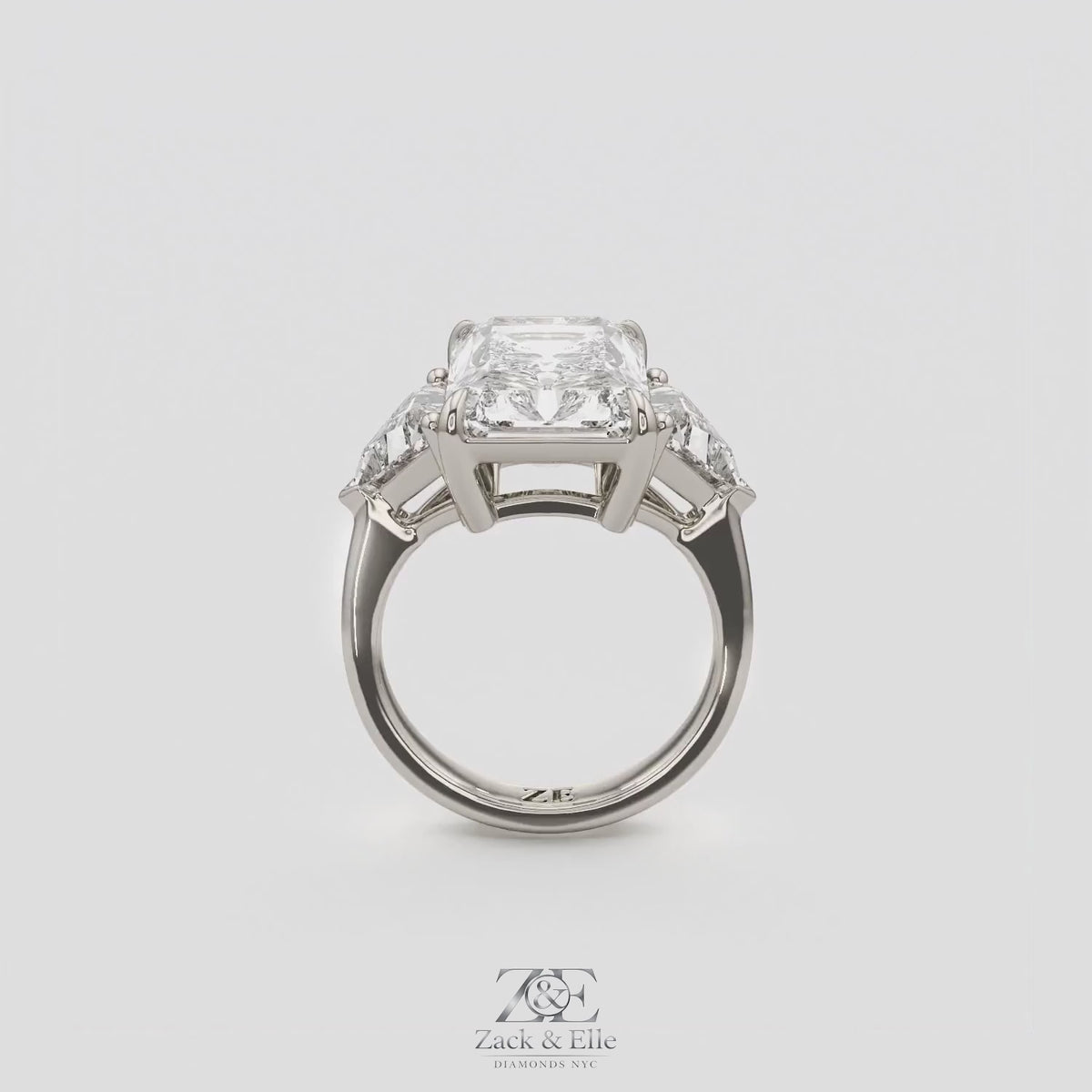 7.20 Ct E VS1 Radiant Cut Lab-Grown Diamond Three Stone Ring with Trapezoid Side Diamonds, in white gold, 360 spin