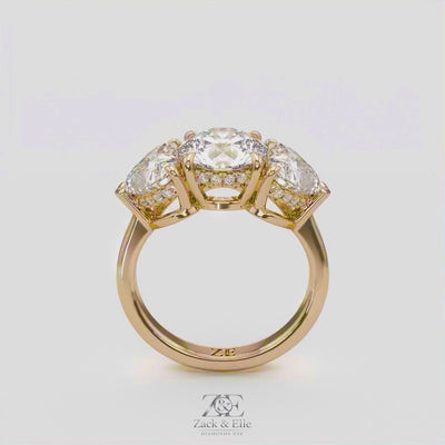 4.15 Ct D VS1 Round 3 Stone Ring With Heart Shape Accents and Halo, in white gold, 360 spin