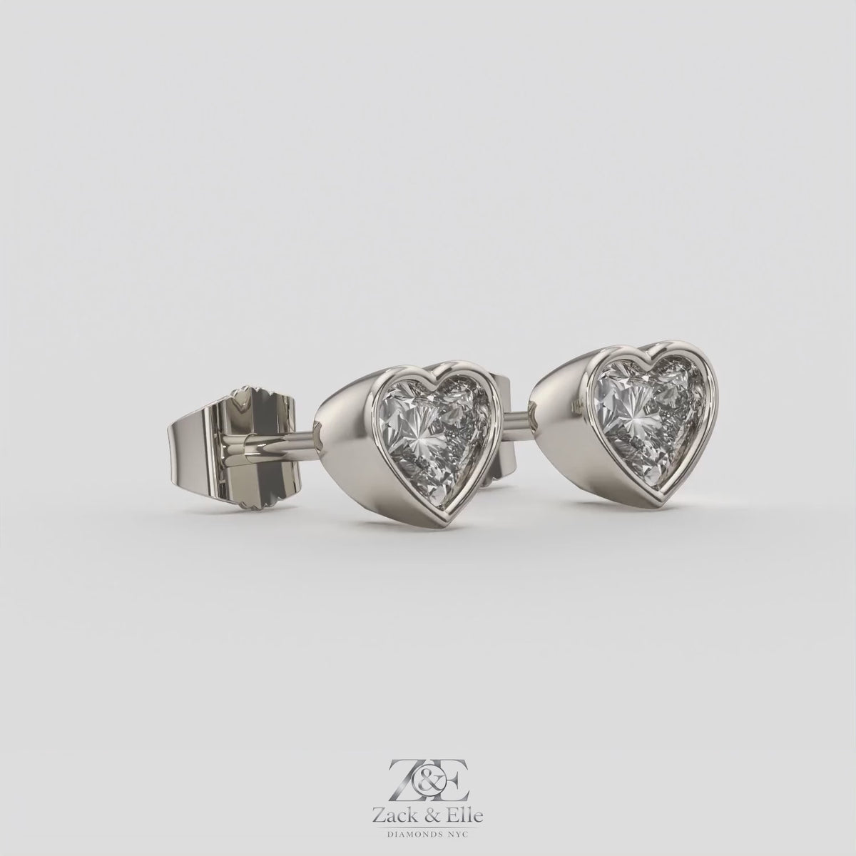 2.00 Ct E VS1 Heart Shape Full Bezel Diamond Studs, in white gold, 360 spin