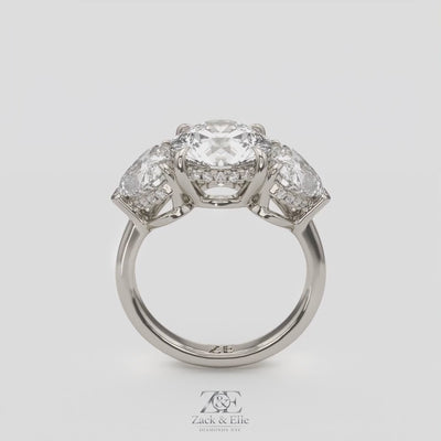 5.20 Ct D VS1 Round Three Stone Ring With Heart Shape Accents and Halo, in white gold, 360 spin
