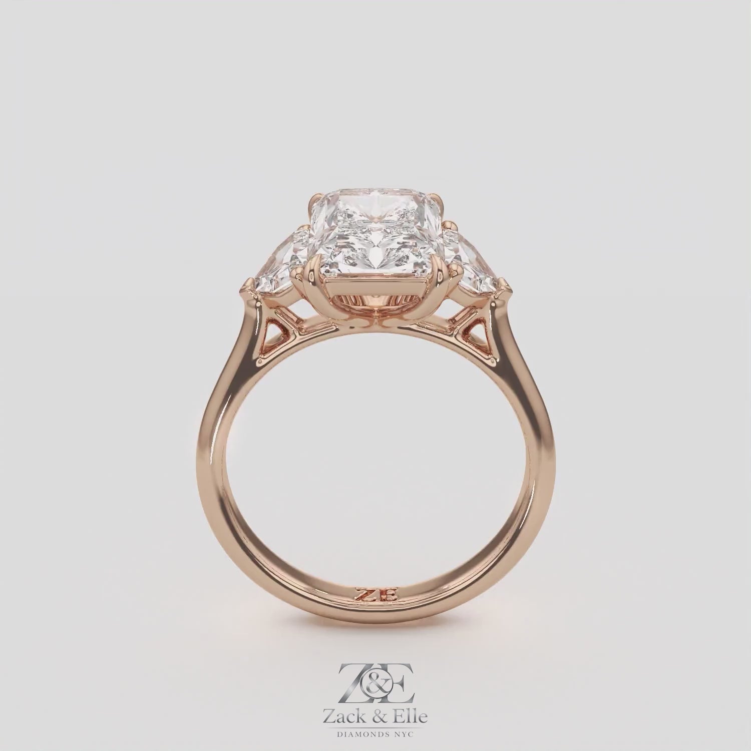 3.50 Ct E VS1 Radiant Three Stone Ring With Trapezoid Accents, in white gold, 360 spin