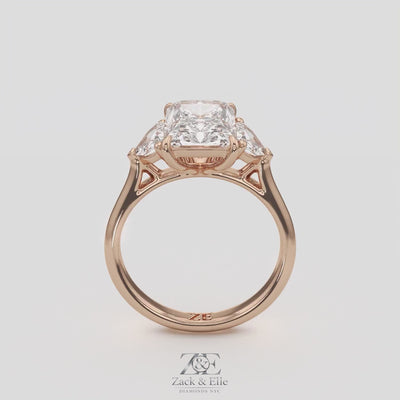 3.50 Ct E VS1 Radiant Three Stone Ring With Trapezoid Accents, in white gold, 360 spin