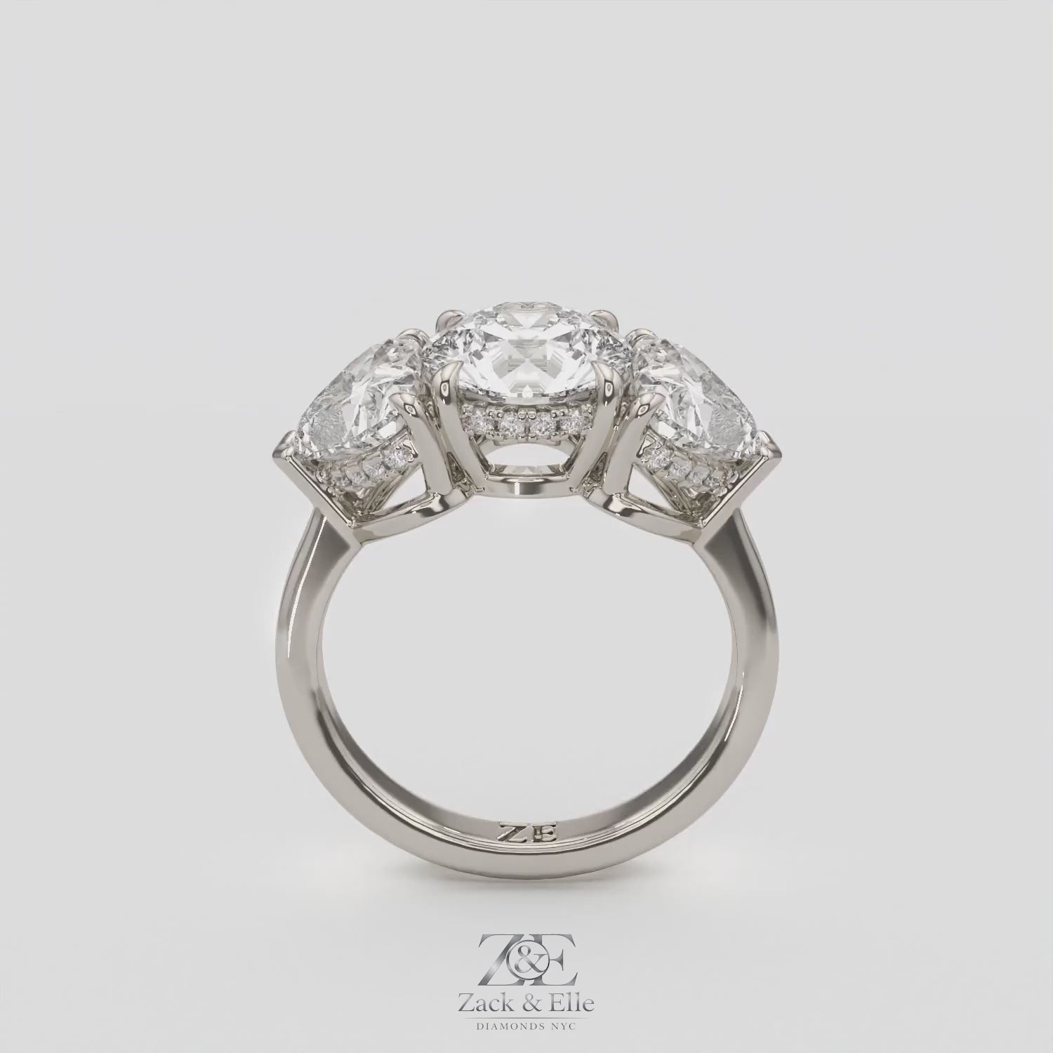 4.15 Ct D VS1 Round 3 Stone Ring With Heart Shape Accents and Halo, in white gold, 360 spin