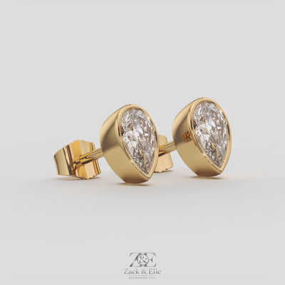 2.00 Ct E VS1 Pear Shaped Full Bezel Lab Grown Diamond Studs, in yellow gold, 360 spin