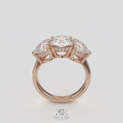 4.15 Ct D VS1 Round 3 Stone Ring With Heart Shape Accents and Halo, in white gold, 360 spin