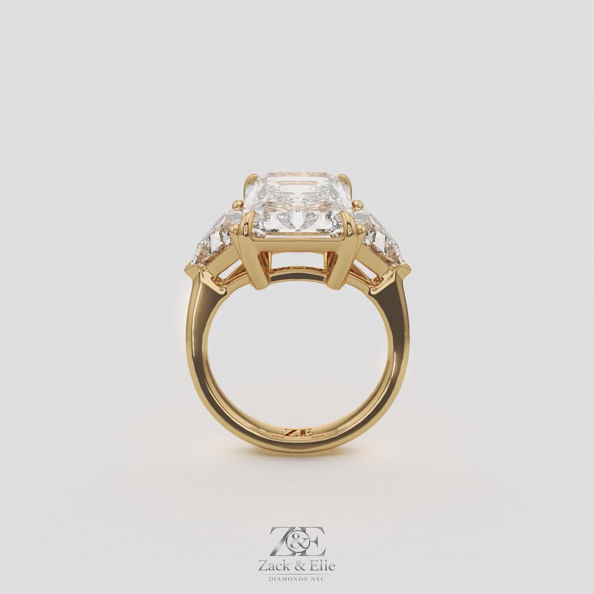 7.20 Ct E VS1 Radiant Cut Lab-Grown Diamond Three Stone Ring with Trapezoid Side Diamonds, in yellow gold, 360 spin