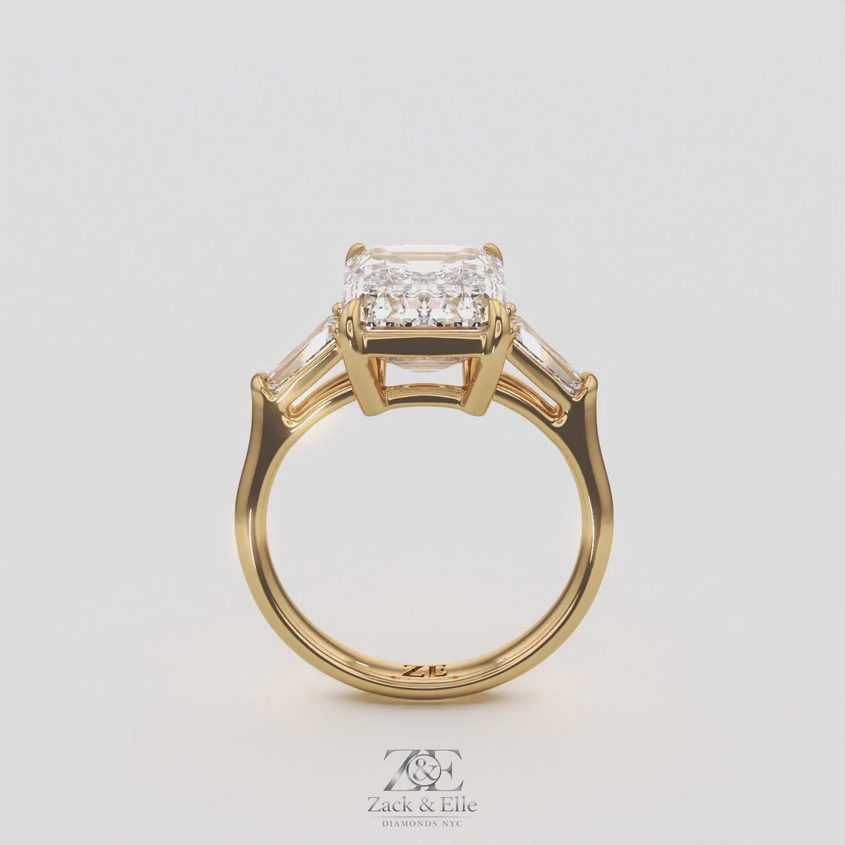5.60 Ct E VS1 Emerald Cut Lab-Grown Diamond Three Stone Ring with Tapered Baguettes, in yellow gold, 360 spin