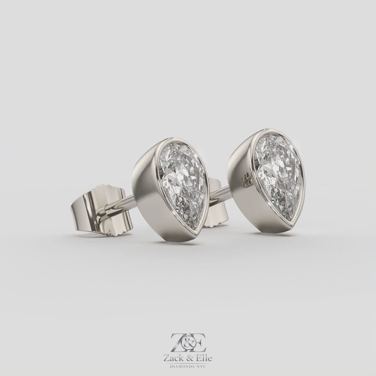 2.00 Ct E VS1 Pear Shaped Full Bezel Lab Grown Diamond Studs, in white gold, 360 spin