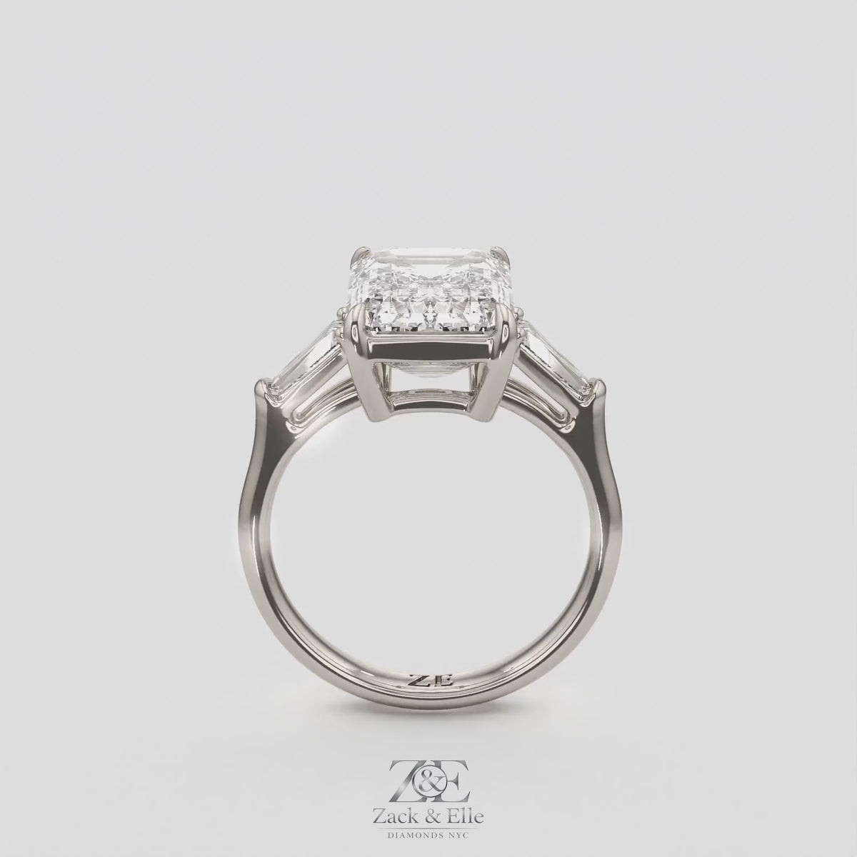 5.60 Ct E VS1 Emerald Cut Lab-Grown Diamond Three Stone Ring with Tapered Baguettes, in white gold, 360 spin
