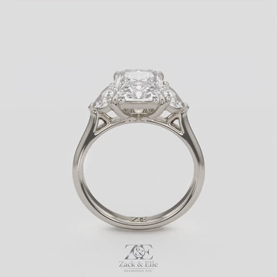 3.50 Ct E VS1 Radiant Three Stone Ring With Trapezoid Accents, in white gold, 360 spin