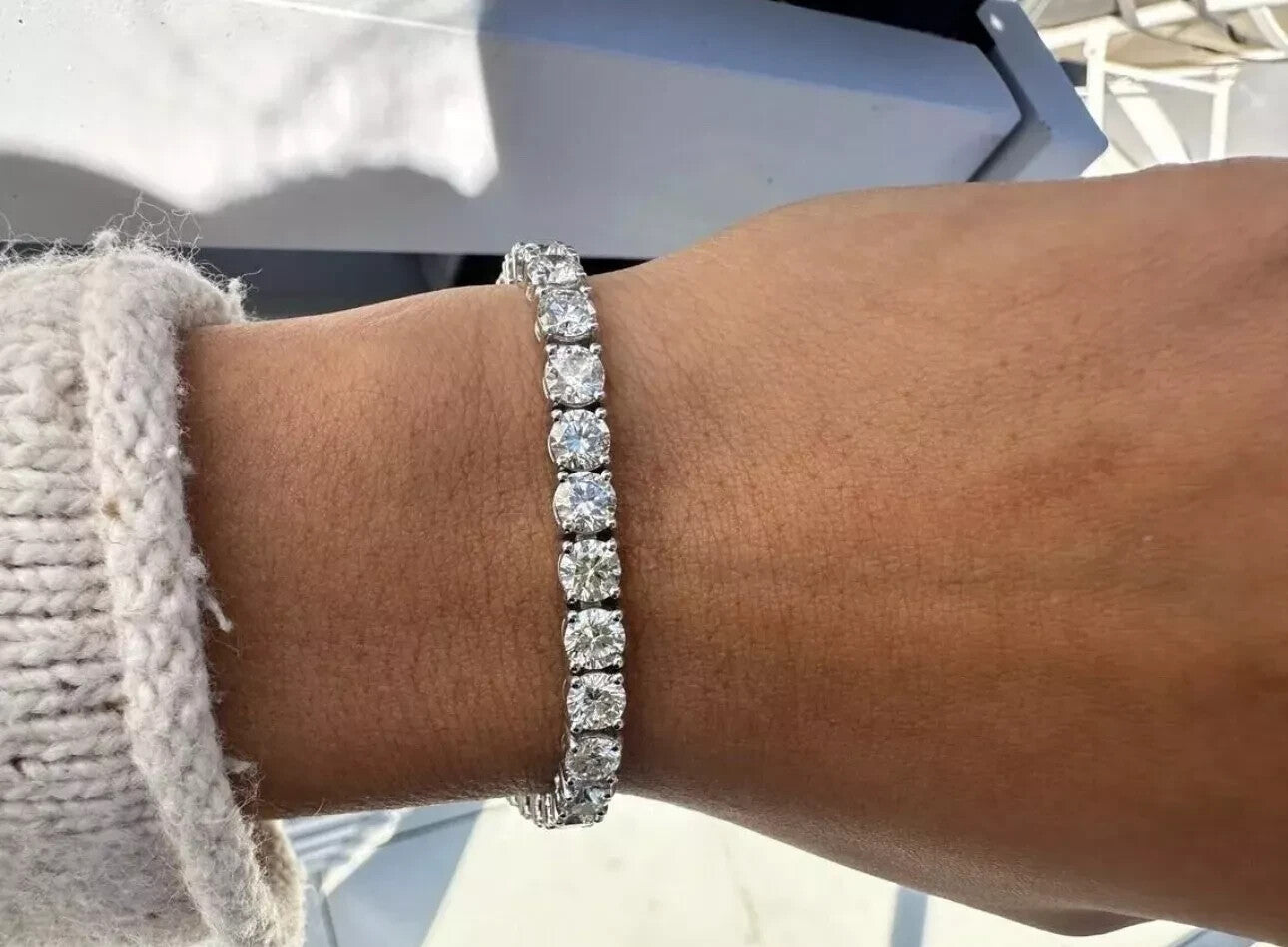 14 carat lab grown diamond tennis bracelet worn on the wrist in 14K white gold