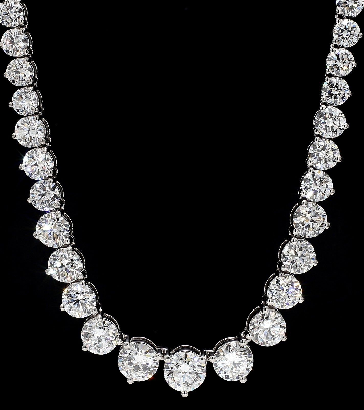 Close up of graduated round brilliant lab grown diamonds in a 14K white gold tennis necklace
