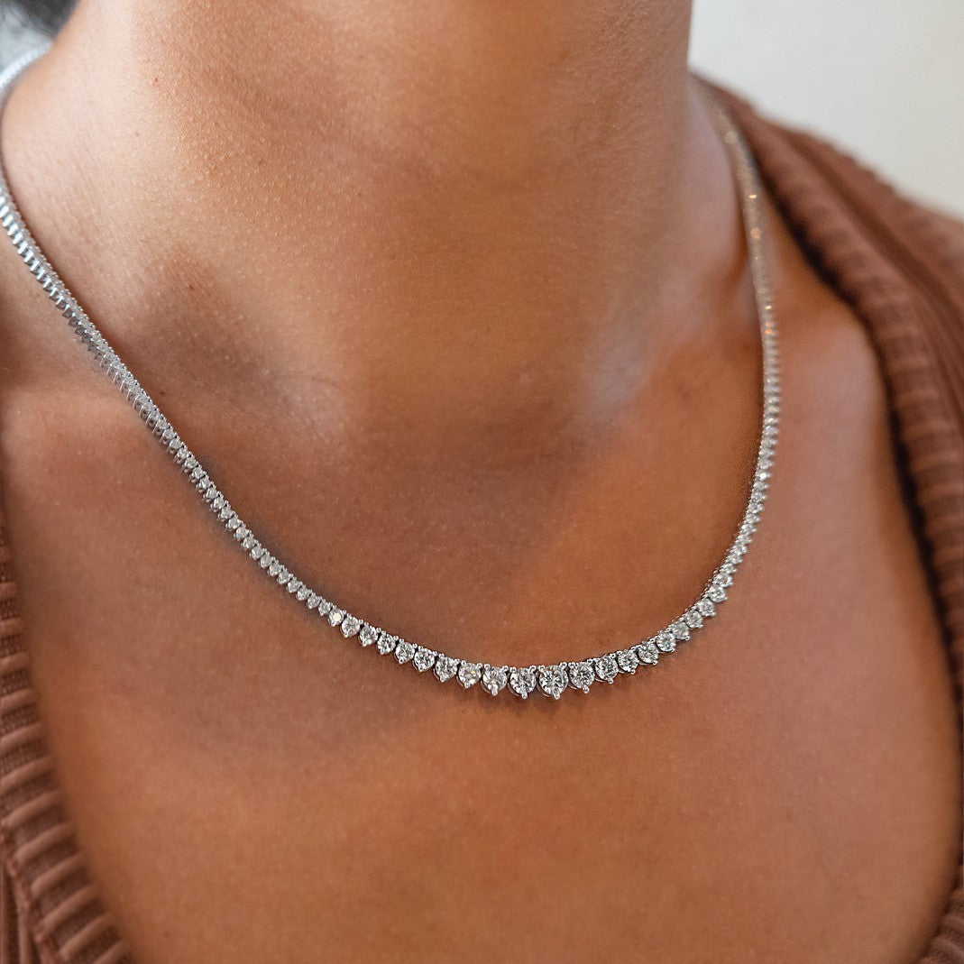 Round brilliant lab grown diamond tennis necklace in 14K white gold shown on the collarbone