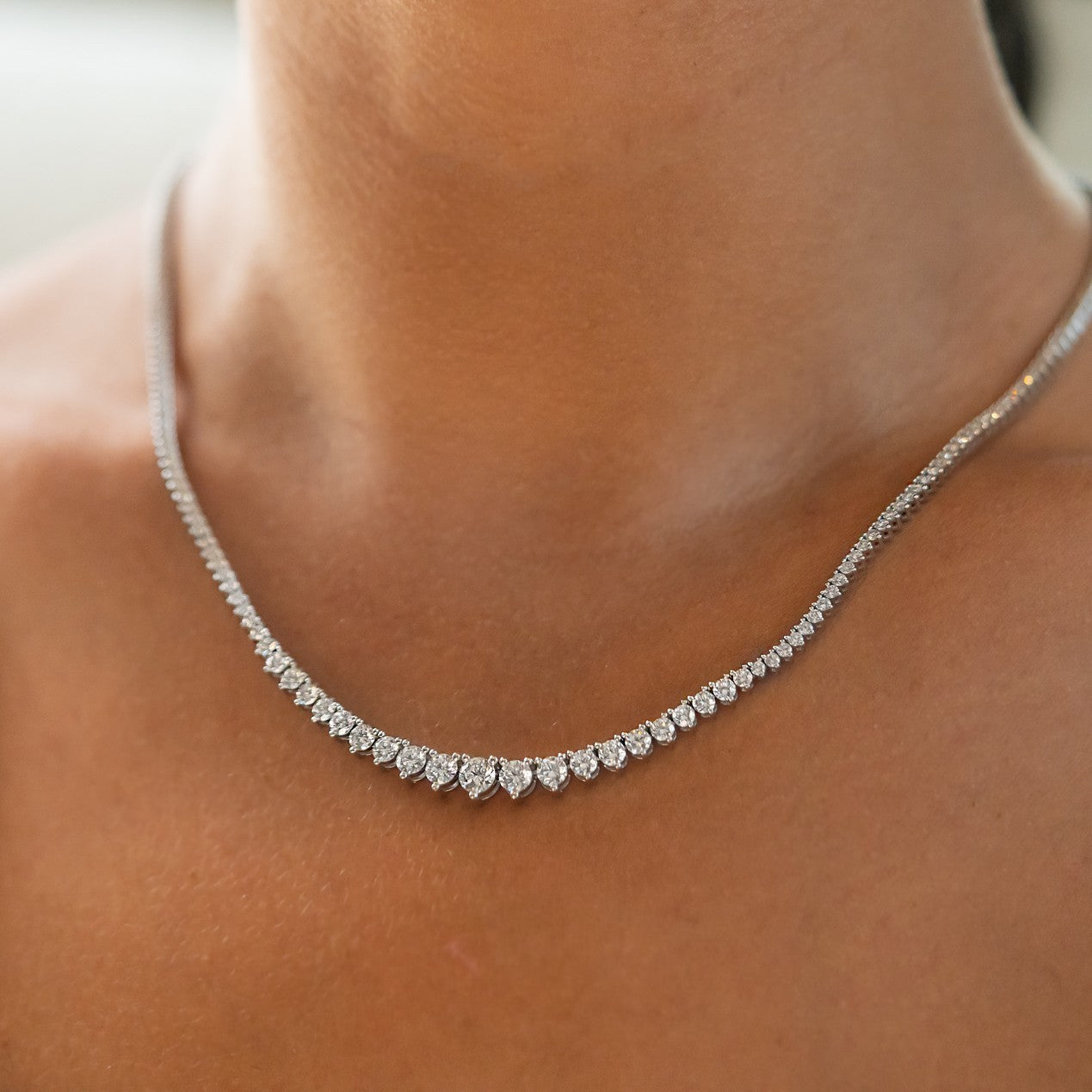 5.63 carat lab grown diamond tennis necklace worn at the collarbone in 14K white gold