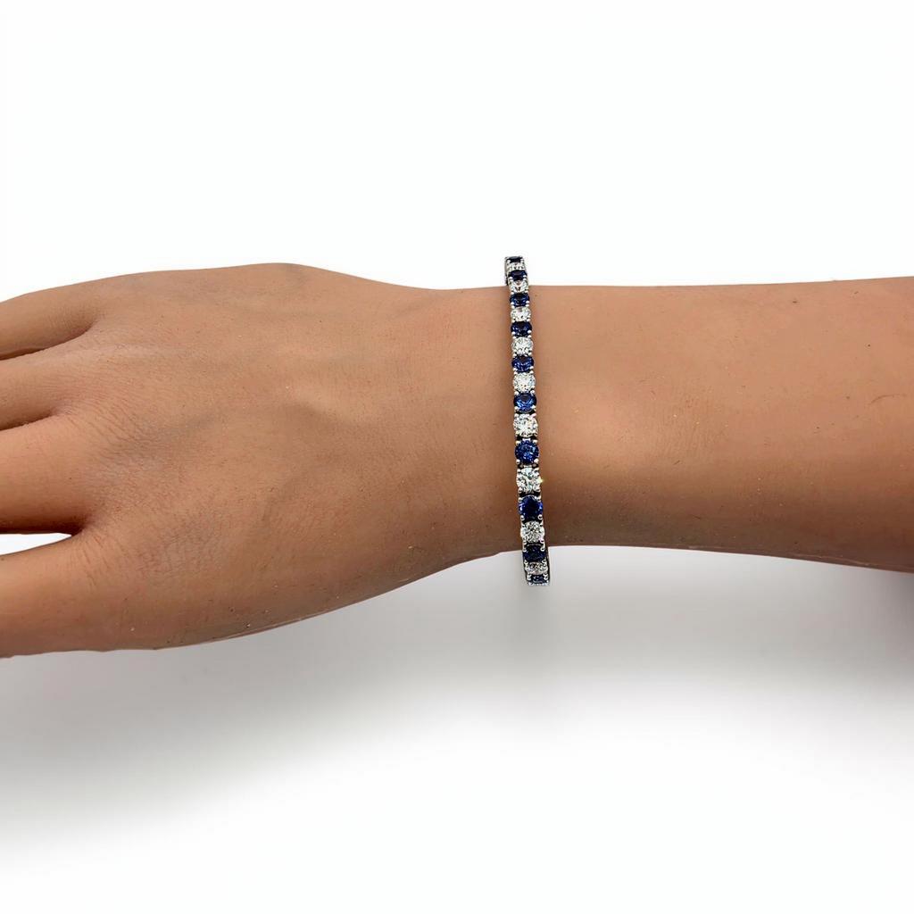 10.00 CTW Round Blue Sapphire and Diamond Tennis Bracelet, in white gold, on hand