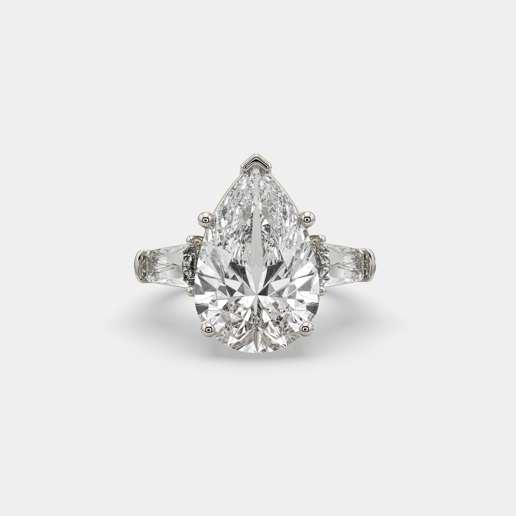 11.50 Ct F Color VS1 Pear Shape Diamond Three Stone Ring With Tapered Baguettes, in white gold, front view