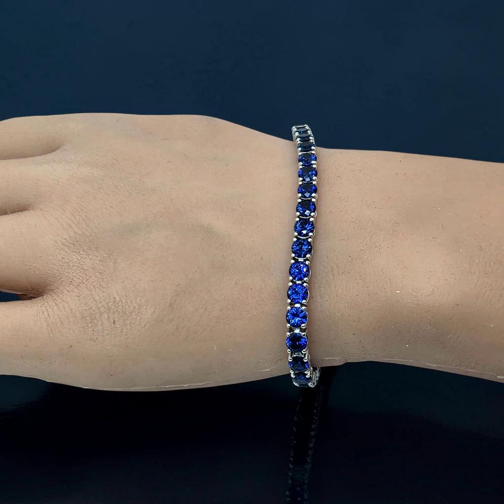 16 CTW Round Blue Sapphire Tennis Bracelet, in white gold, on hand