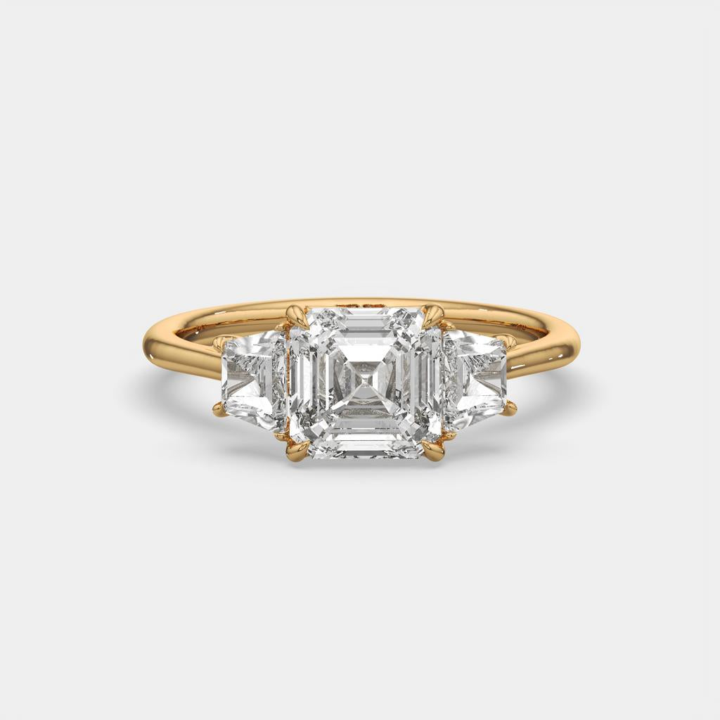 2.50 Ct D VS1 Asscher Cut Three Stone Ring With Step Cut Trapezoid Accents, in yellow gold, front view