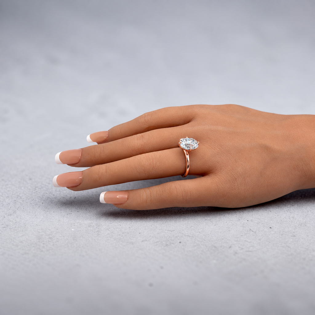 3.00 Ct E VS1 Old Mine Cushion Lab-Grown Diamond Solitaire Ring, in rose gold, on hand