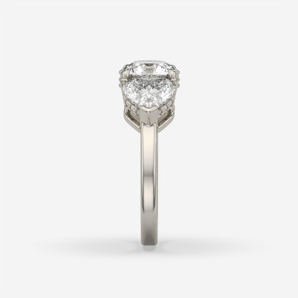 4.15 Ct D VS1 Round 3 Stone Ring With Heart Shape Accents and Halo, in white gold, side profile