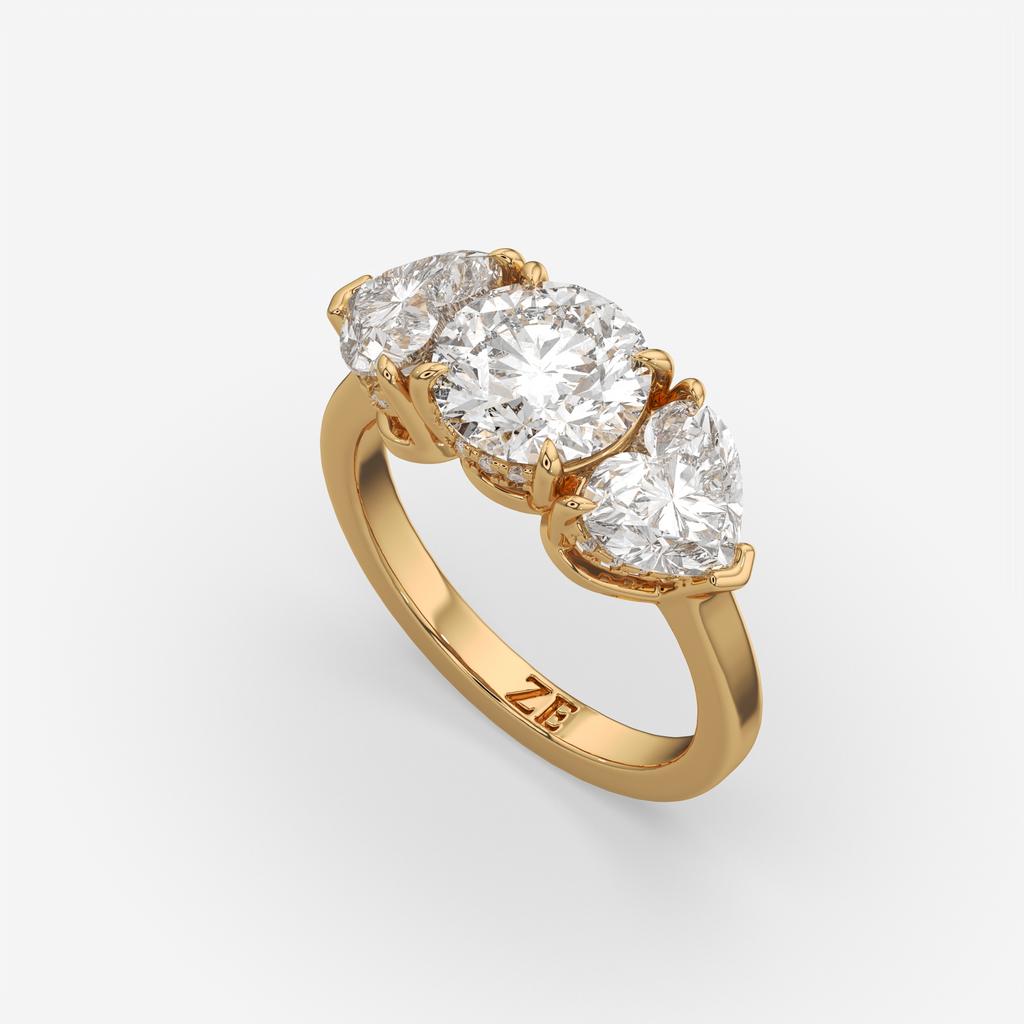 4.15 Ct D VS1 Round 3 Stone Ring With Heart Shape Accents and Halo, in yellow gold, front view