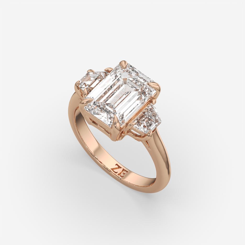 4.60 Ct E VS1 Emerald Cut Diamond Three Stone Ring with Step Cut Trapezoid Accents, in rose gold, front view