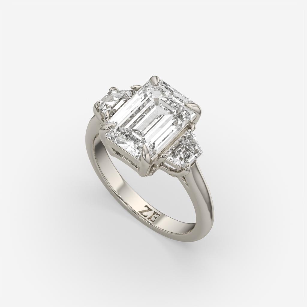 4.60 Ct E VS1 Emerald Cut Diamond Three Stone Ring with Step Cut Trapezoid Accents, in white gold, front view