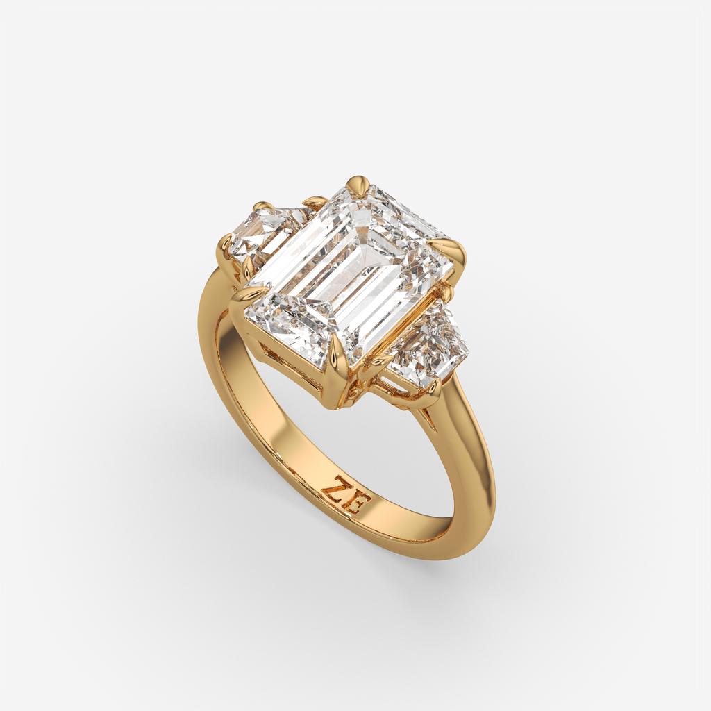 4.60 Ct E VS1 Emerald Cut Diamond Three Stone Ring with Step Cut Trapezoid Accents, in yellow gold, front view