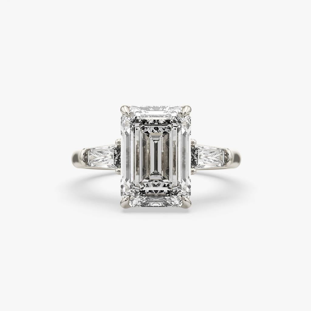 5.60 Ct E VS1 Emerald Cut Lab-Grown Diamond Three Stone Ring with Tapered Baguettes, in white gold, front view