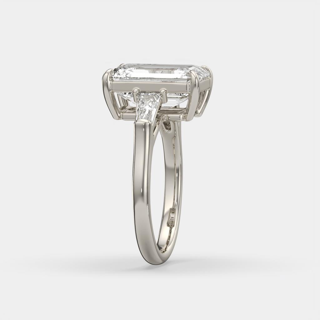 5.60 Ct E VS1 Emerald Cut Lab-Grown Diamond Three Stone Ring with Tapered Baguettes, in white gold, side profile