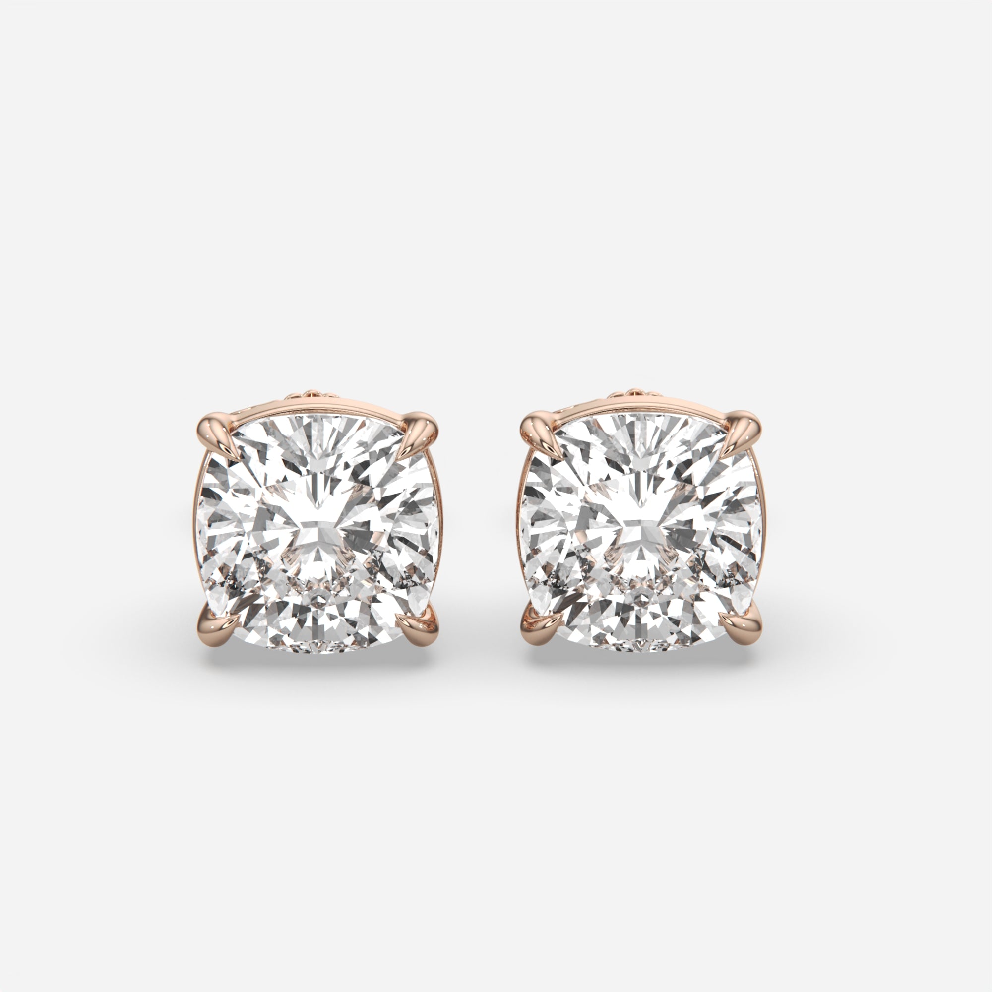 6.00 Ct Cushion Cut Eagle Claw Diamond Studs, eagle claw setting, in 14k rose gold, pair, front view