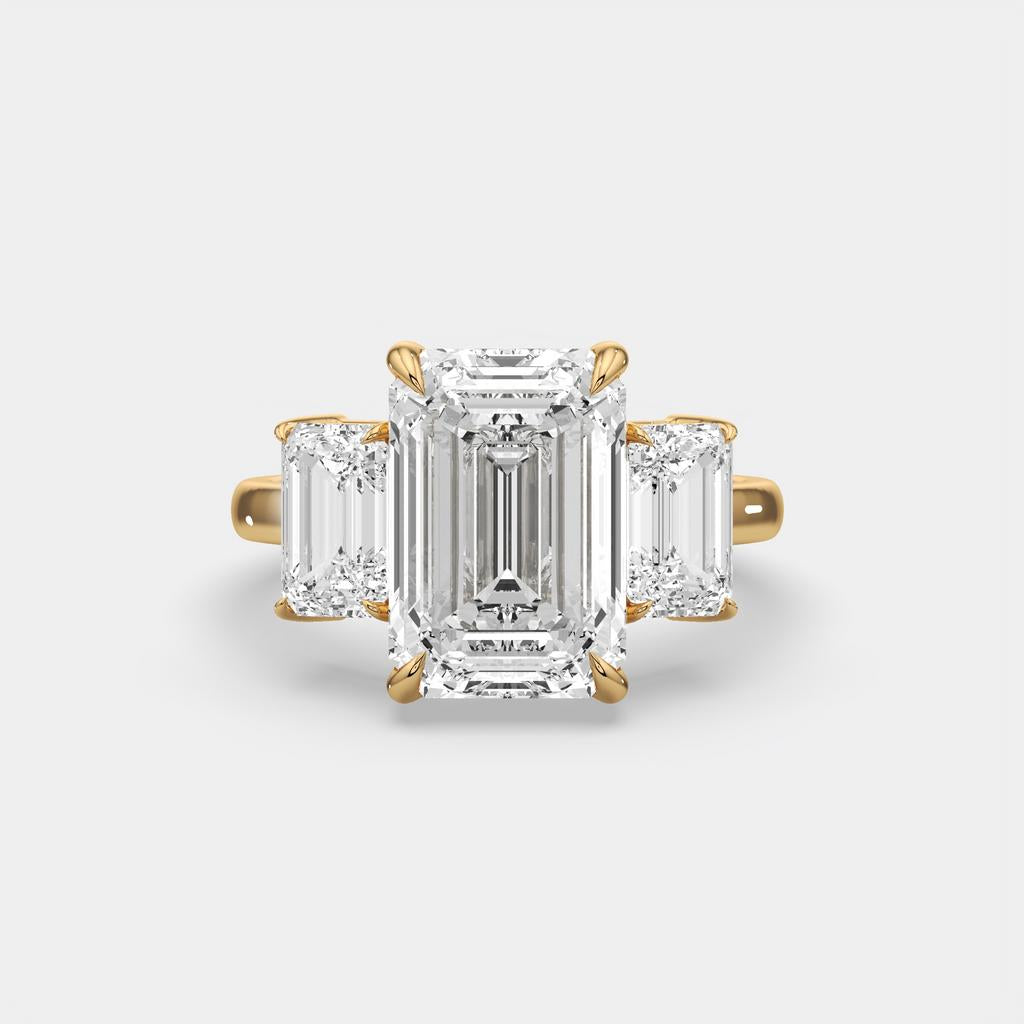 8.00 Ct E VS1 Emerald Cut Lab Grown Diamond Three Stone Ring, in yellow gold, front view